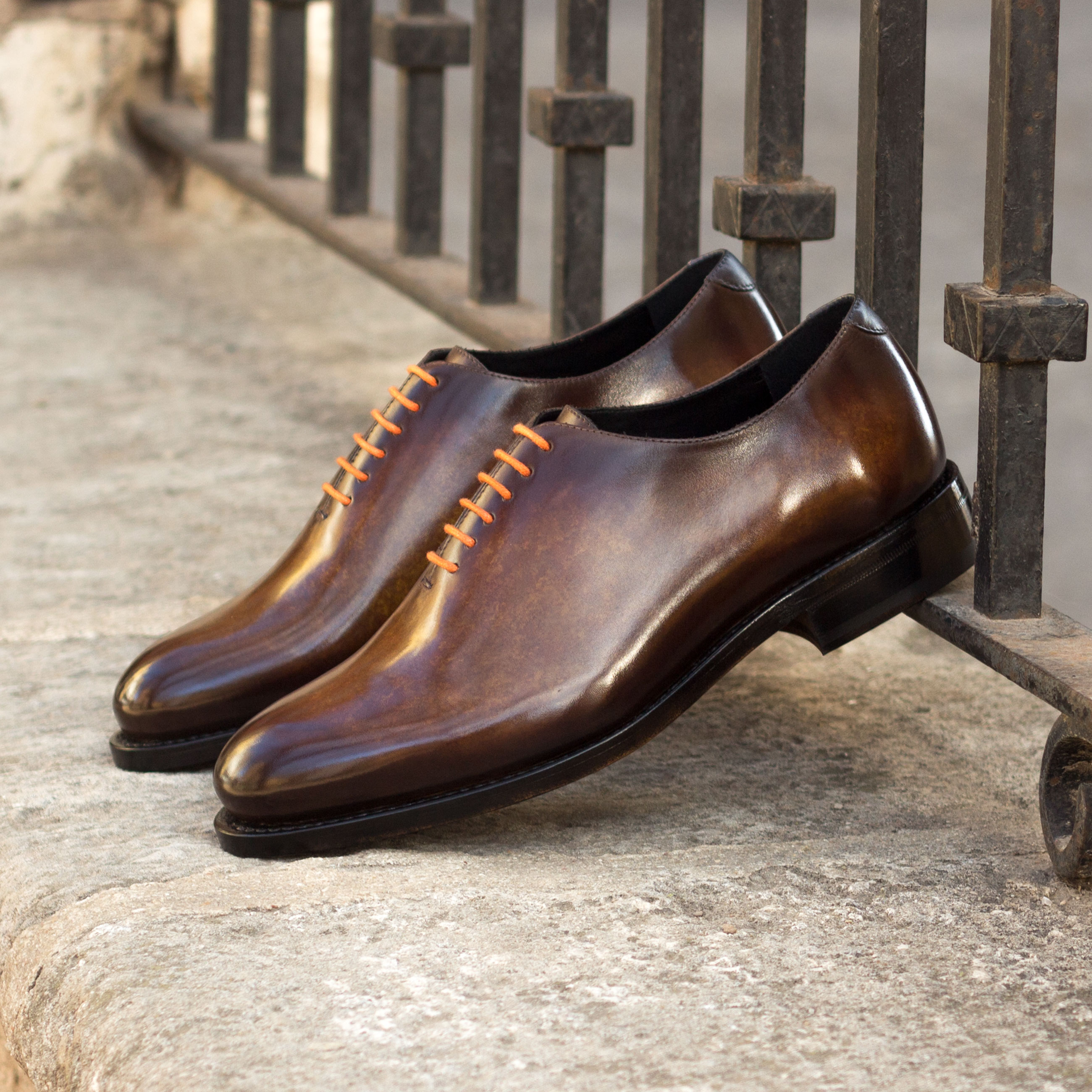 Whole-cut custom dress shoe with hand-painted patina finish.